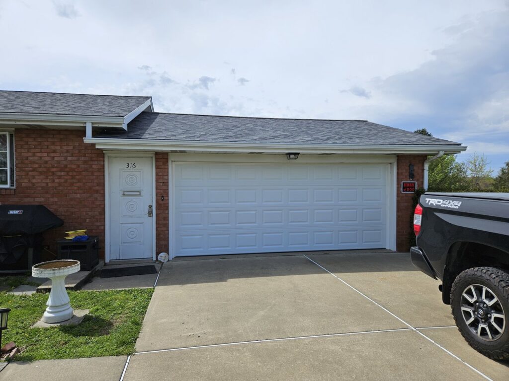 White panel garage door on a residential home, installed by Access Door Systems in Uniontown, PA.