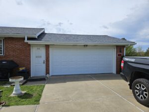 White panel garage door on a residential home, installed by Access Door Systems in Uniontown, PA.