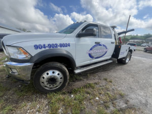A white Ram wrecker tow truck, branded with Southeastern Towing Inc., parked and ready in Chattanooga, TN.