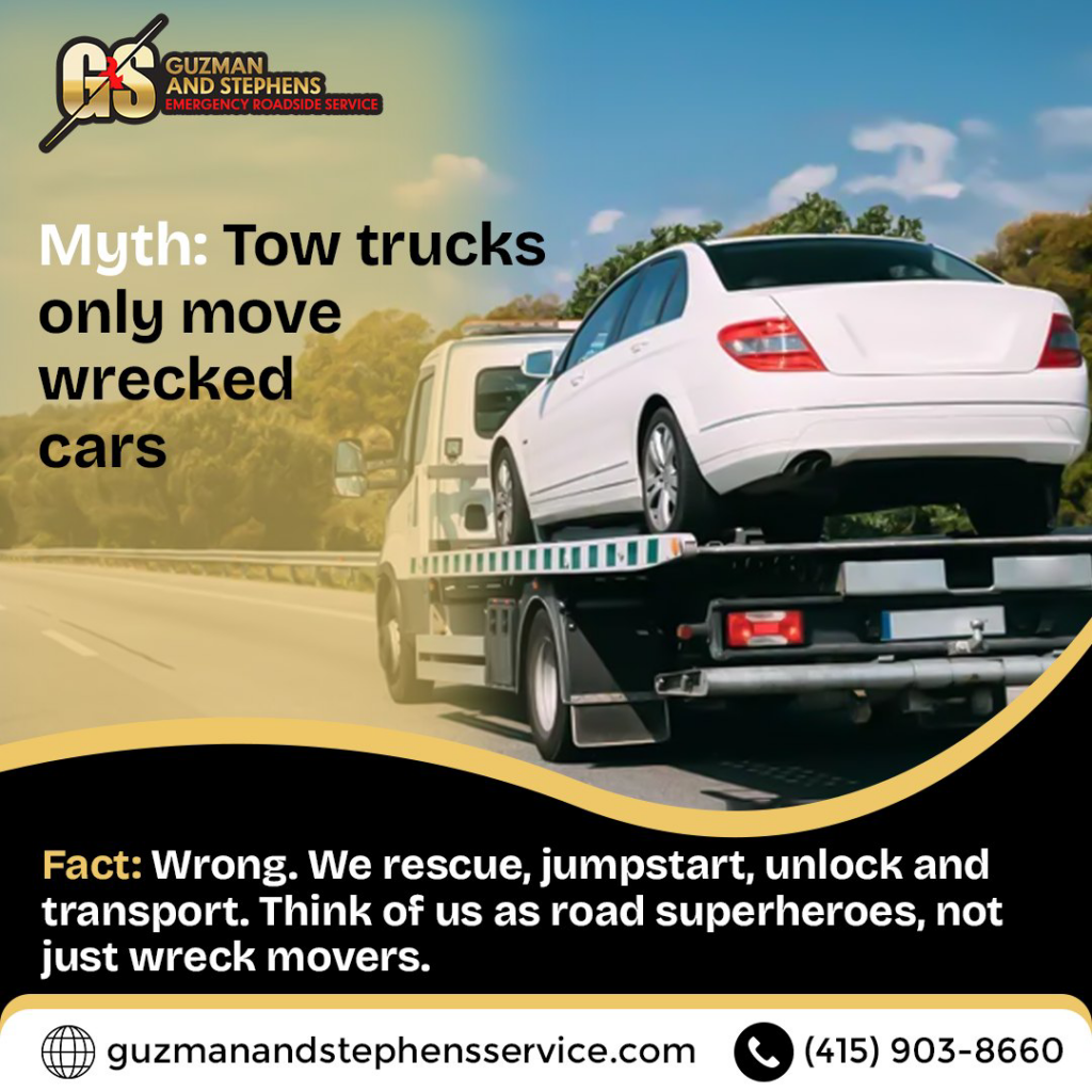 A white sedan being transported on a flatbed tow truck by Guzman Towing Services in Oakland, CA.