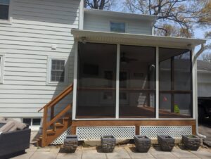 The pristine white siding on a home exterior completed by Annapolis Painting Services Inc in Annapolis, MD