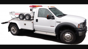 A white wrecker tow truck available for emergency towing from St Pete Towing Services in Saint Petersburg, FL.