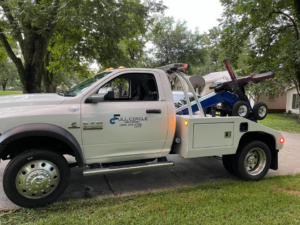 A white wrecker from Full Circle Towing and Recovery towing equipment with a wheel-lift in Dothan, AL.
