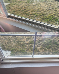 Before and after photos of a clean window sill and glass, demonstrating services by Sheridan Spotless Spaces, LLC in Sheridan, WY.