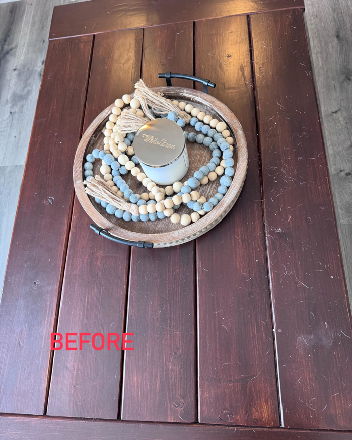 A wooden coffee table before house cleaning service by J&J clean services in Pittsburgh, PA.