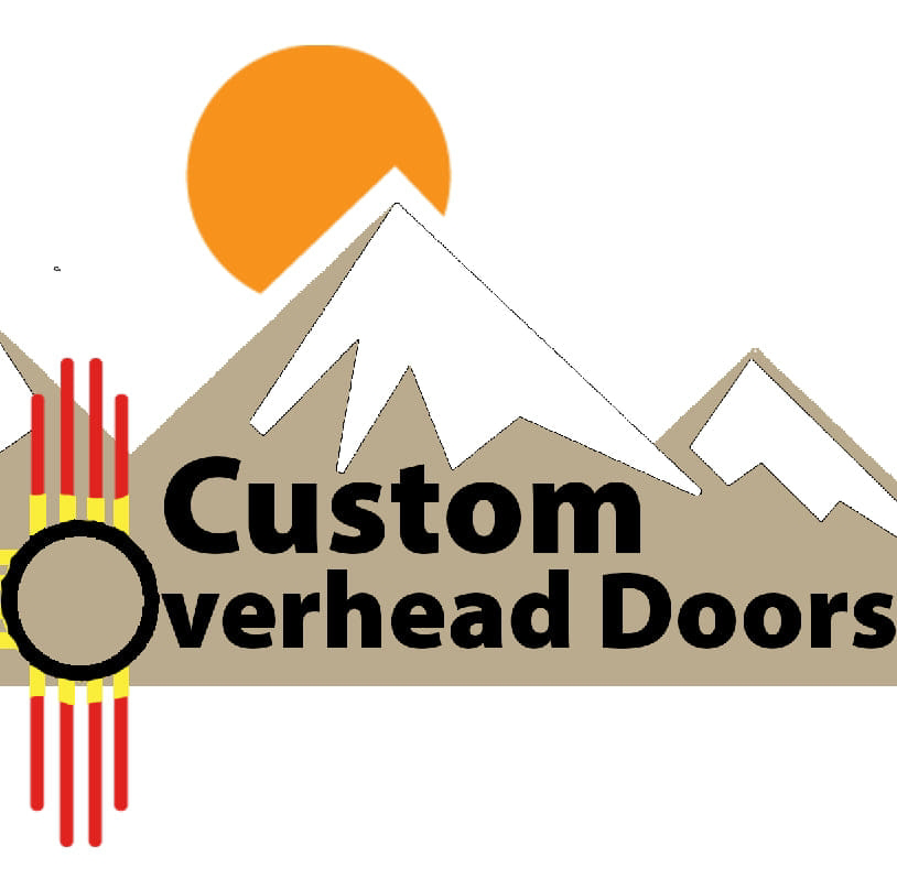 A beautiful wooden garage door installed on a stone house by Custom Overhead Doors of Southern New Mexico in Alamogordo, NM.